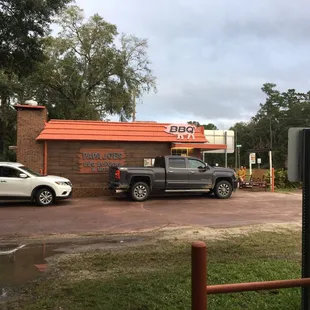 two trucks parked in front of a restaurant