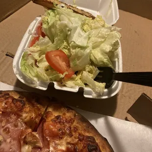 a salad and a slice of pizza