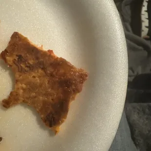 a half eaten pizza on a plate
