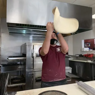 a man making a pizza