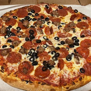 a pepperoni and olive pizza