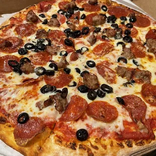 a pepperoni and olive pizza