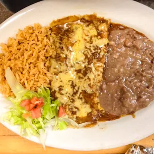 Beef or Cheese enchiladas with rice and beans.