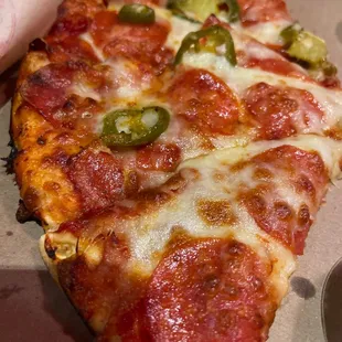 Pepperoni and jalapeño with extra cheese thin slice