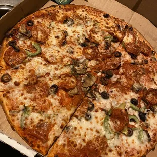 Dry the works pizza with a shortage of olives