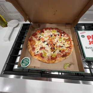 Pepperoni, onion, black olives , and banana peppers