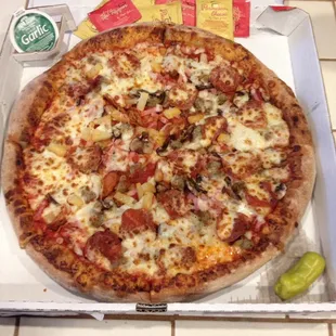 5 topping large pizza with: sausage, pepperoni, mushroom, Canadian bacon, and pineapple. Included as usual: cheese and pizza sauce