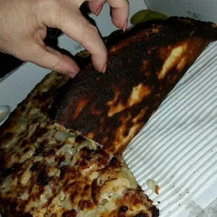 The pizza arrived piping hot.....unfortunately it was burnt to a crisp!