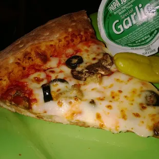 Slice of sausage, Portobello mushrooms and black olives.