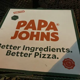 pizza on the table in front of the restaurant