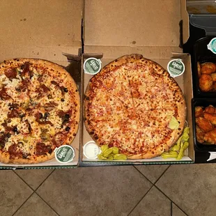 The Works Original Crust Pizza, canadian bacon and pineapple 2 topping pizza, buffalo boneless wings, and hot lemon pepper wings