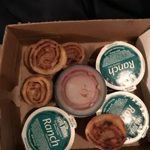 a box of doughnuts and yogurt