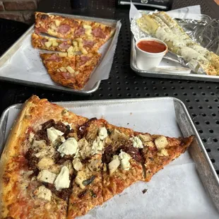 Tuskeno Slice in the foreground &amp; Canadian Bacon /Pineapple in the back.