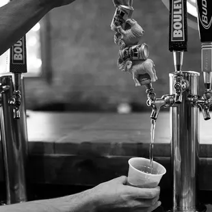 a person pouring a drink