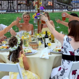 Cheers to our delicious food and beautiful backyard wedding!