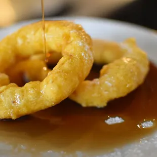 Picarones: Sweet Potato doughnuts made from scratch and prepared to order. Served hot straight out the fryer.
