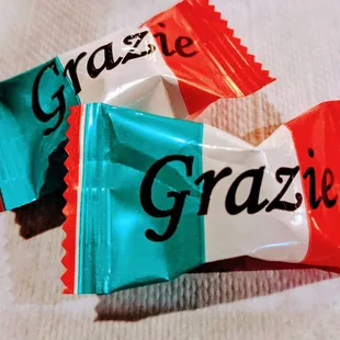 two candy bars with the word grazzi on them