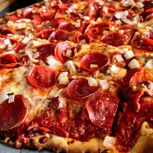 a pepperoni and onion pizza