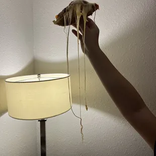 Cheese pull on pizza