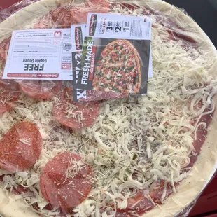 a pizza with pepperoni and cheese