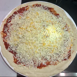 a pizza with cheese and sauce