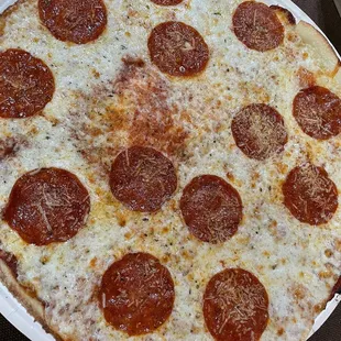a pepperoni pizza on a plate