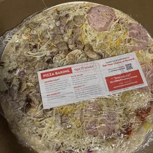 a pizza with meat and cheese