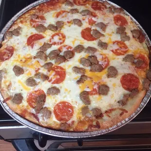a pizza on a pan on a stove