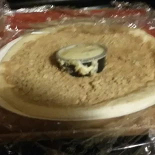 an uncooked pizza on a tray