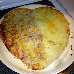 Heart shaped pizza for Vday, half red sauce, half creamy garlic.