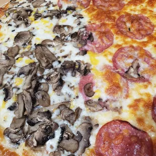 pizza cooked, large half salami, half mushroom