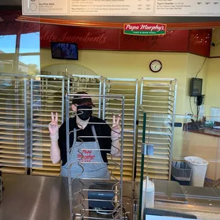 a man in a mask and apron