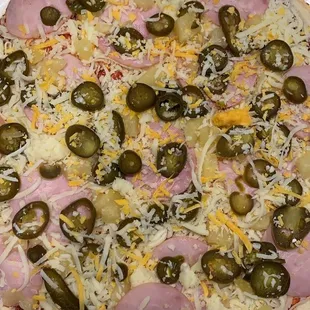 a pizza on a paper plate