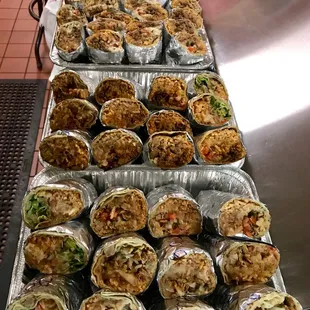 a variety of burritos