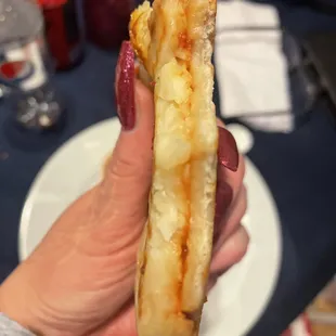 The top layer closest to my thumb is allll cheese