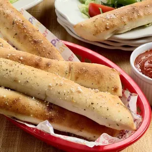 Homemade Bread sticks brushed with organic herbs fresh garlic butter