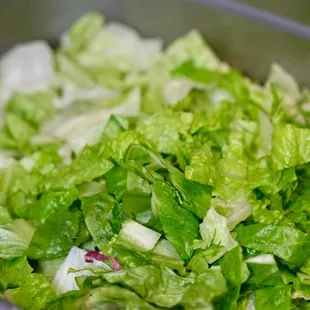lettuce and onions in a pan