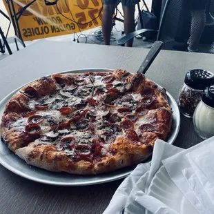 a pizza on a plate on a table