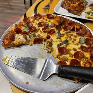 a pizza with a slice missing