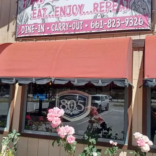 Front of building with beautiful roses