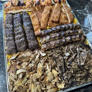 Tray for 6. Also includes pita, 2 white bean stews, 2 lentil soups, large fries, and pickle veggies. Everything was amazing.