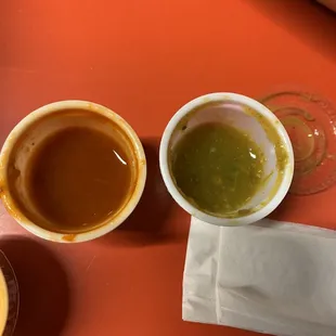 two cups of coffee and a napkin