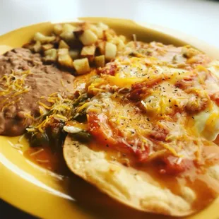El Huevon Ranchero!  Two eggs, any style, smothered in Ranchero Sauce, served on two lightly fried corn tortillas.