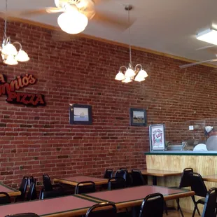 a brick wall and tables