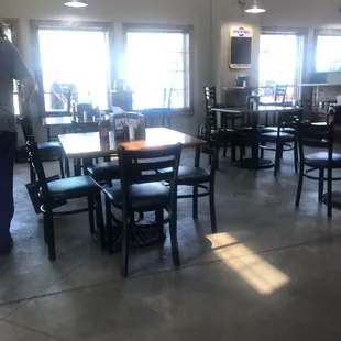 a restaurant with tables and chairs
