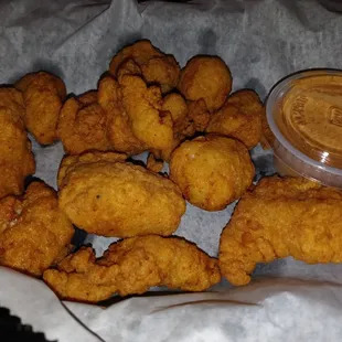 a basket of fried chicken nuggies