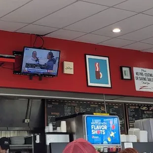 Quant wall decor and a menu on the back wall.