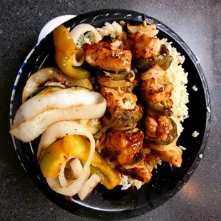 Chicken kabobs with rice pilaf and grilled veggies
