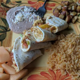 Breakfast quesadillas with fruit, potatoes, rice, and beans.  One of the best breakfasts in town.