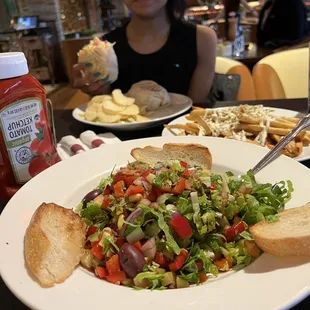 a plate of salad and bread